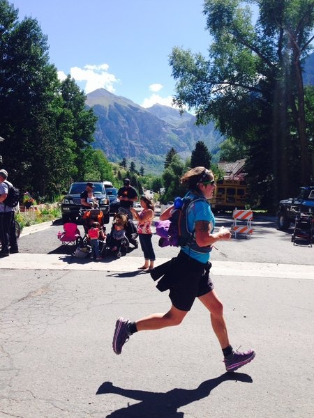 Michelle runs into Telluride down the last stretch to the finish line.