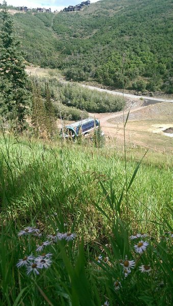 Looking down to the Mountaineer Express chairlift from the Pipeline Trail