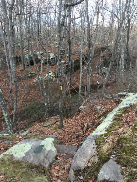 Descending a rocky, granite ridge on Sap Brook Trail.