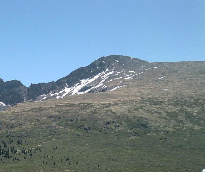 Mt. Bierstadt from the main TH. Much of the route is visible, with the trail starting from the lower left of the picture and jogging up the center hill. From here it passes along the summit ridge to the right. The sawtooth is to the left of the summit.