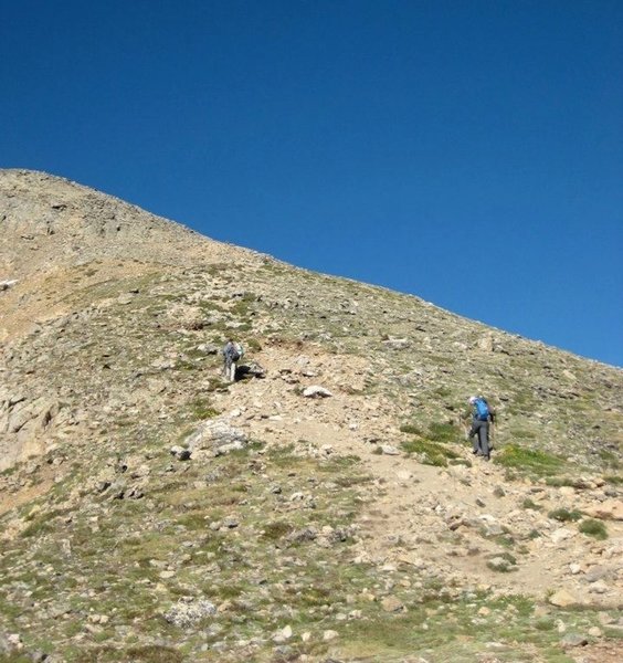 The crux of the route, a steep and slightly rocky pitch before the first false summit.