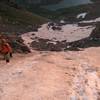 Climbing up some snow on Broken Hand Pass, July 2011.