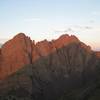 A stunning view of Crestone Needle (left) and Crestone Peak (right), with morning alpenglow above the shadow of Humboldt Peak.