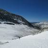 A hiker/skier working toward the fun part of this climb: a spring ski descent.