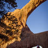 Double O Arch with hikers for scale