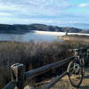 Looking out to the reservoir and dam. Trails go off to the left and right.