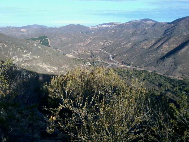 Looking back down to the ranger station. You can see "The Way Up" trail zig-zagging up the sunlit slope on the left.