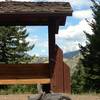 A memorial rest stop with a surprise view of Longs Peak way off in the distance.