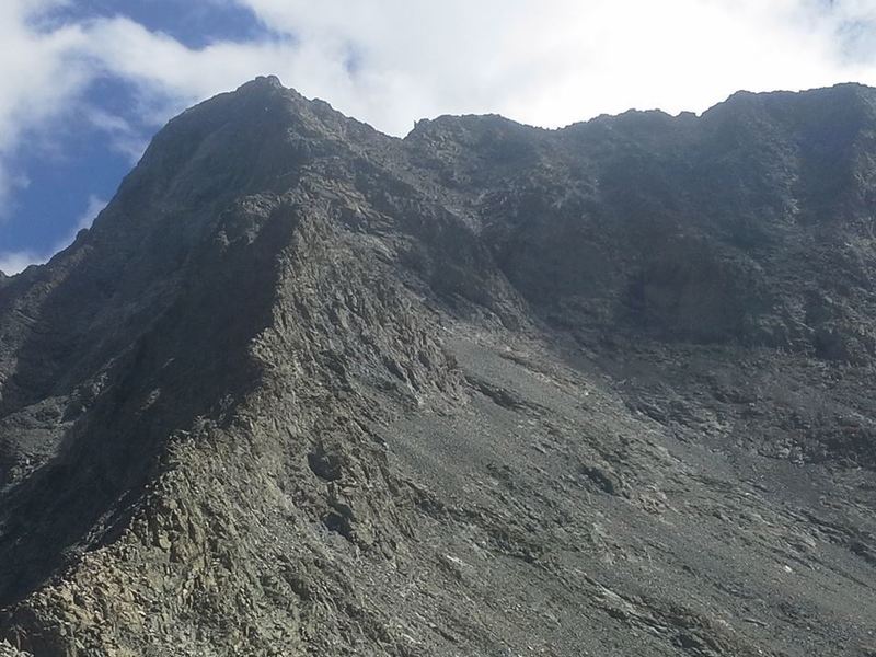 A look back from the top of the final gully toward the Hourglass and its basin. To reach this point, hike along just to photographer's right of this ridge.  Little Bear Peak Trail