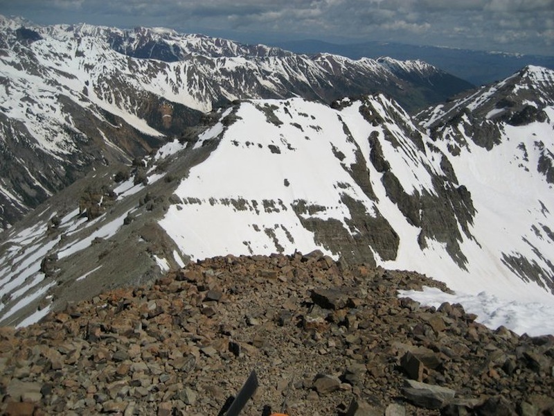 View from the summit of Castle Peak. To the left is the saddle to which you'll descend. Conundrum is right in front of you, with its technical couloir just right of center. Conundrum's summit is up and to the right of the couloir.