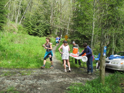 Trail runners refueling at an aid station during the 2014 OAT Run, held on this trail every April.