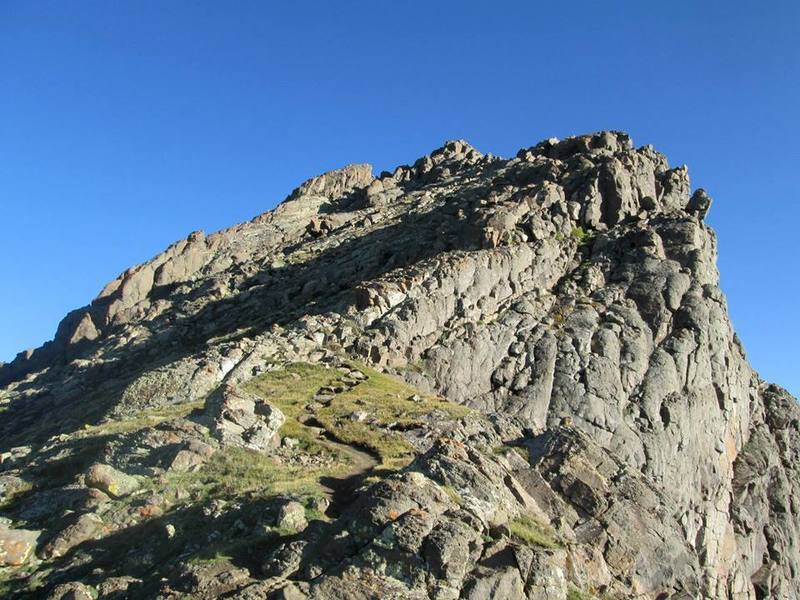 Pass "the Prow," the finlike rock formation in the distance, on its right.