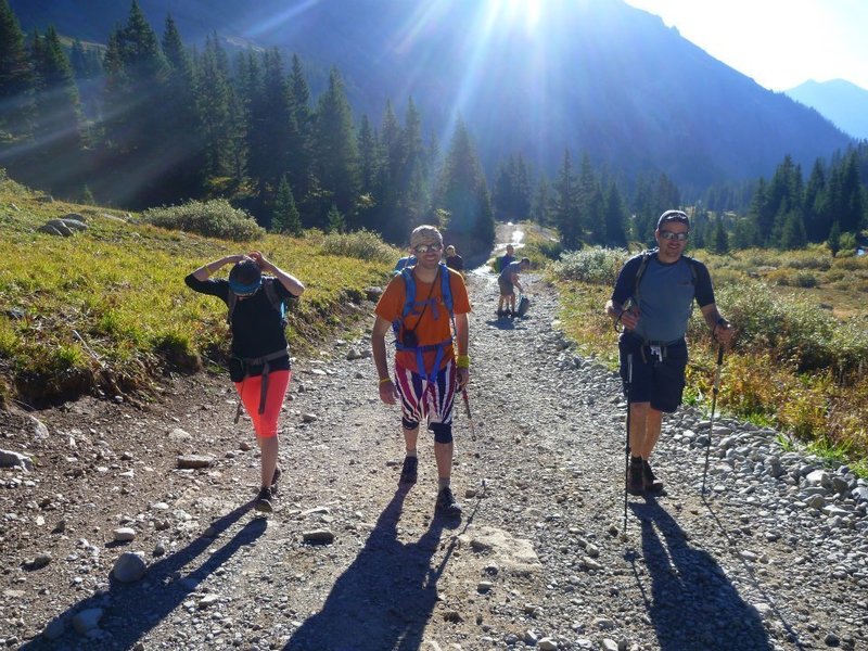 Hikers a short distance below the upper trailhead.