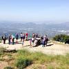 At the dramatic ruined staircase and historical marker signage near the ruins of the old lodge. On clear days, you can see the ocean to the west and south as well as fantastic views of downtown LA.