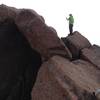 Look at this guy, just standing near the exposed summit. No big deal. The climber on the lower right can be seen working her way up the slab. From the higher hiker, it's just two jumps onto the highest boulder.