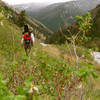 Hiking up Bear Trap Canyon Trail with a packraft.