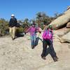 Hiking across slick rock. Just watch for cairns to find the next segment of trail.