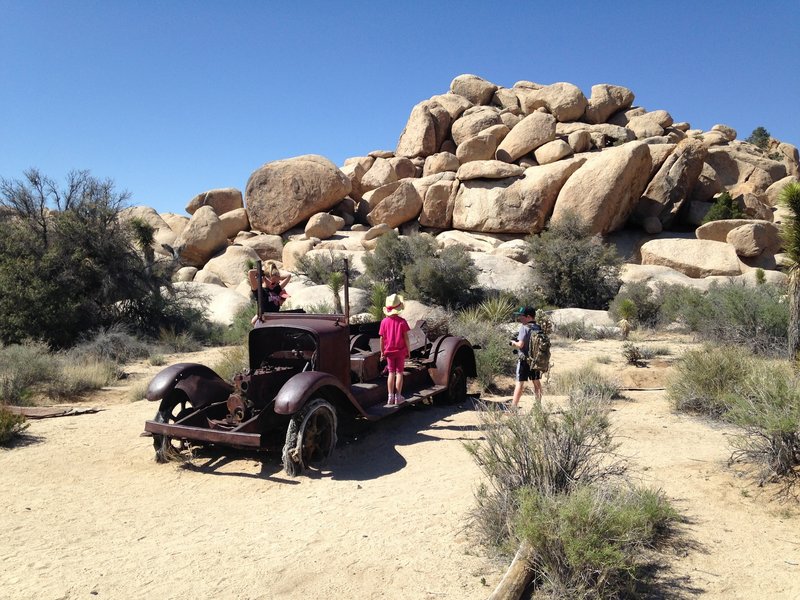 Kids getting up close and personal with some of the relics on the Wall Street Mill trail.