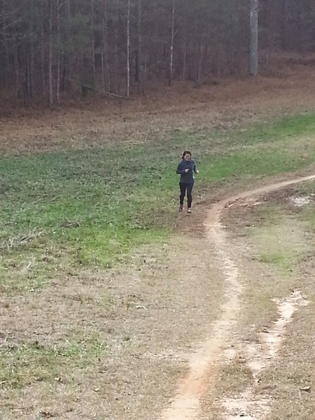 My wife (ha ha ha Borat), running through the clearing.