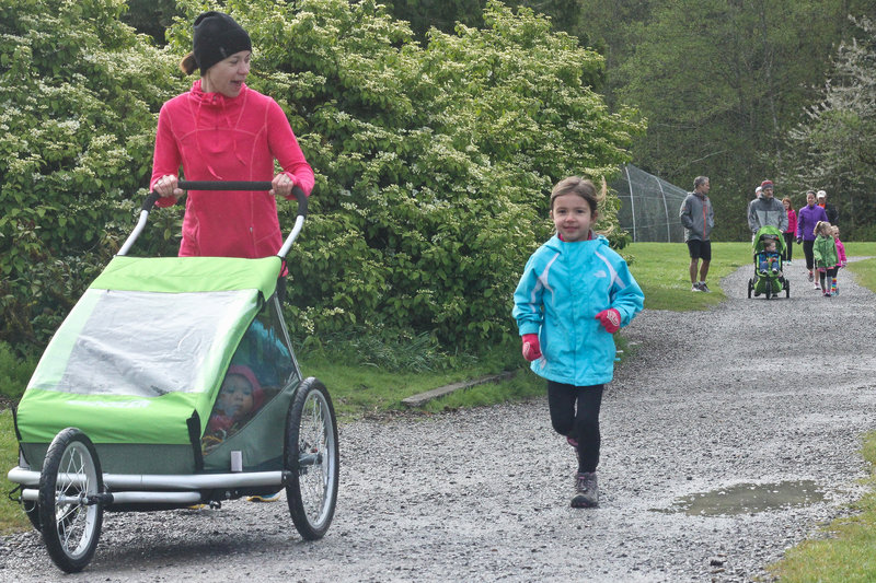 A little runner enjoys a flat section of the Lake Padden Loop.