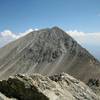 Taken from the summit of nearby 13er Iron Nipple, this picture shows Mt. Lindsey Trail leading up into the gully. The alternative ridge can also be seen on the right side of the mountain.