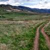 The beginning of Box 'o Rox trail is doubletrack but will soon change to singletrack. You can see I-70 going up into the mountains in the background.