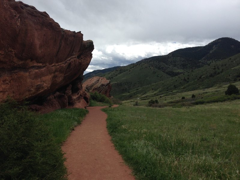 An amazing rock face and southern hills on the Trading Post Loop Side Trail at Red Rocks Park and Amphitheater.