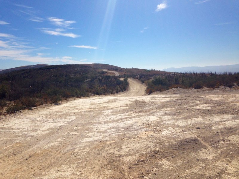 This is a rocky portion of the trail with a wide area.