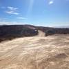 This is a rocky portion of the trail with a wide area.