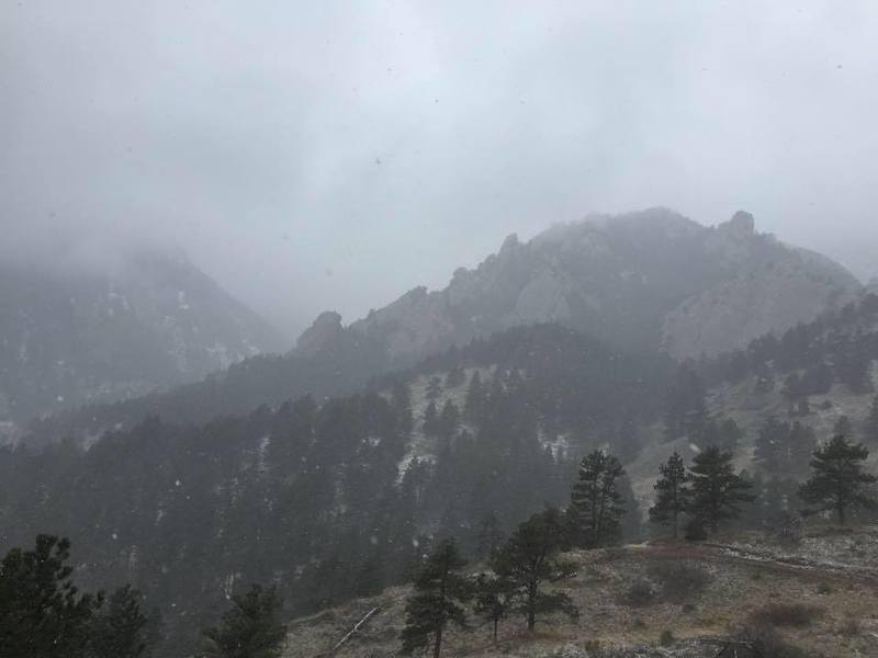 The hills of South Boulder during a March snow on the NCAR trail