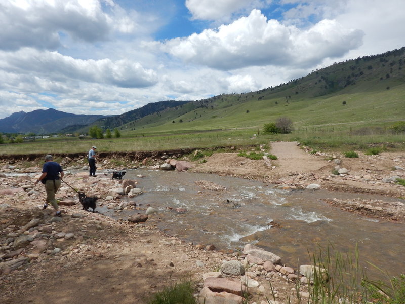 The 2013 flood took out this section of trail.  As of spring 2015 you still have to take off your shoes and wade through.