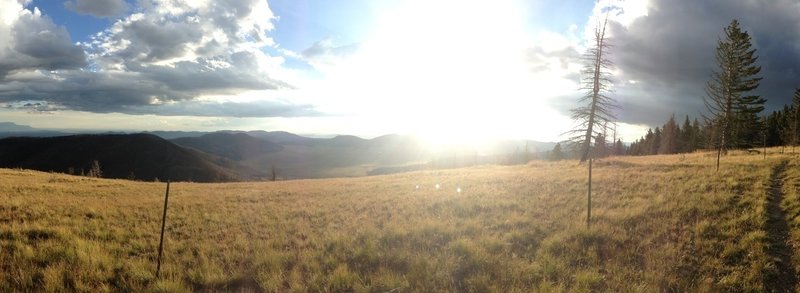 Sunlight spilling through the clouds slowly filling the Valles Caldera.