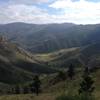 View from the trail back down from Greyrock Mountain. The trail follows along the side of the mountain affording panoramic views.