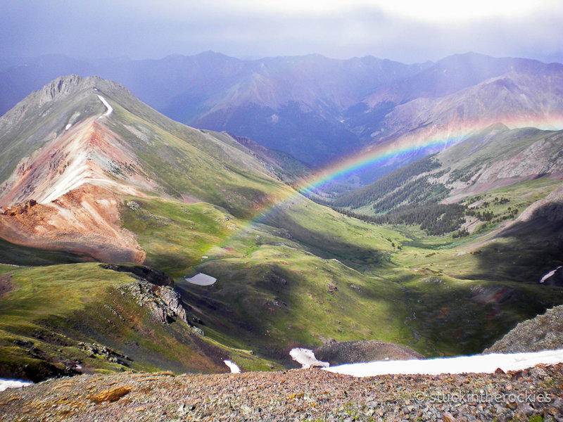 Near the summit of Handies Peak, 14,048 ft., the high point of the race course. A passing storm created a rainbow over Grizzly Gulch. July 2009.