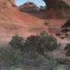 Looking up at the final arch and the 4th class scramble route (contour from right to left until you reach the chopped steps and then head up through the arch).