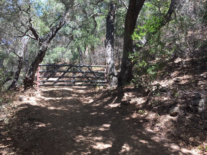 Fence closing off access to motor vehicles.