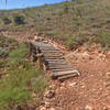 A short bridge for cyclists on Mayberry. The slats are far apart, so it's better to take the trail around instead.