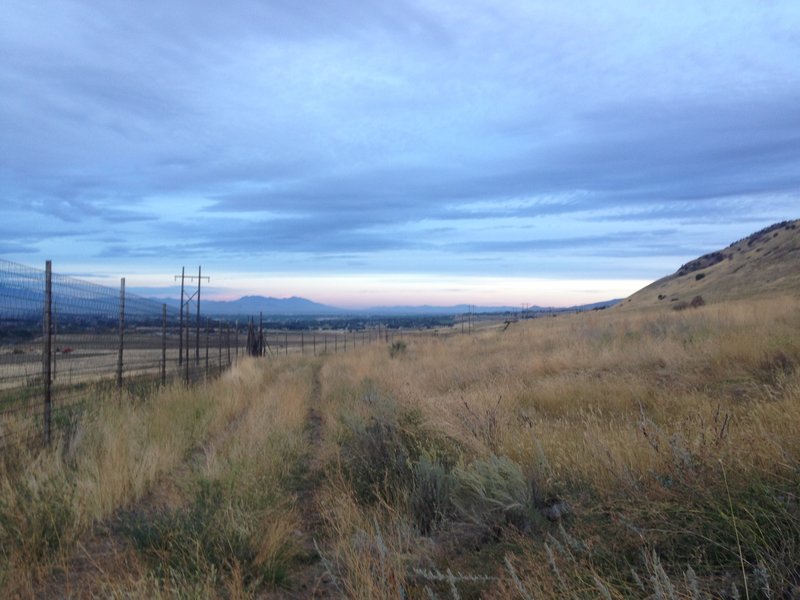 A view of the sunrise over the trail.