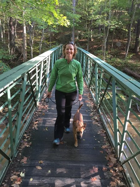 Heather and Paco on the bridge that crosses Crabtree Creek.