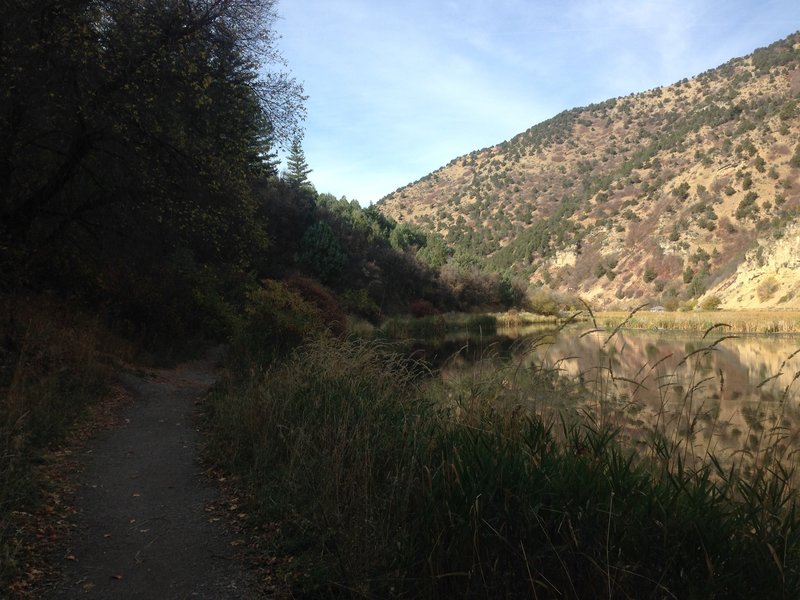 The trail winding west around Third Dam.