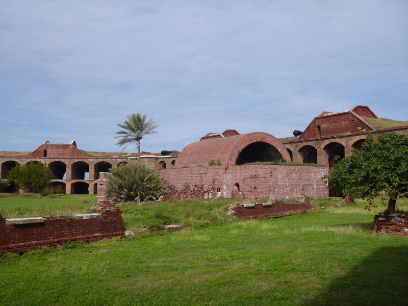 Standing in the inner grounds, looking toward the powder magazine with the arched roof.