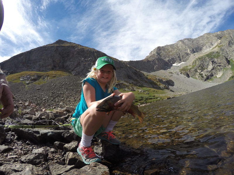 KT with a giant hybrid cutthroat trout from Upper Sand Creek Lake.