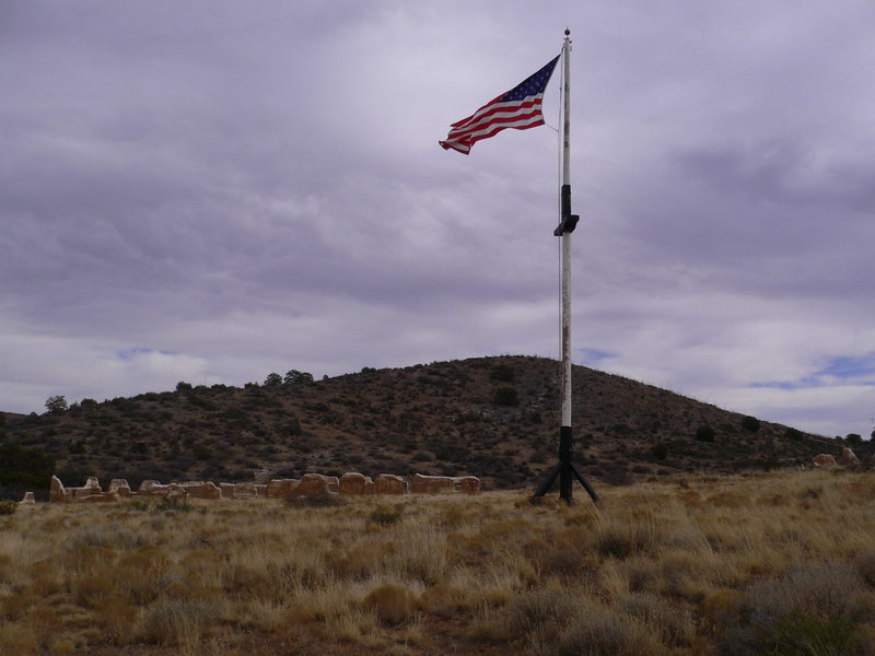 Flag flying among ruins at Fort Bowie.