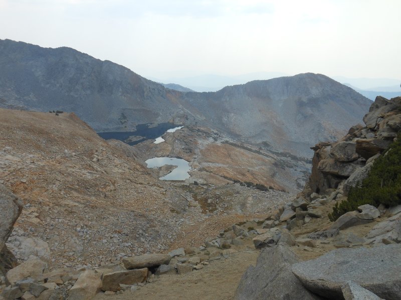 Looking south through smoke from fires from Red Peak Pass toward Upper Ottoway Lake.