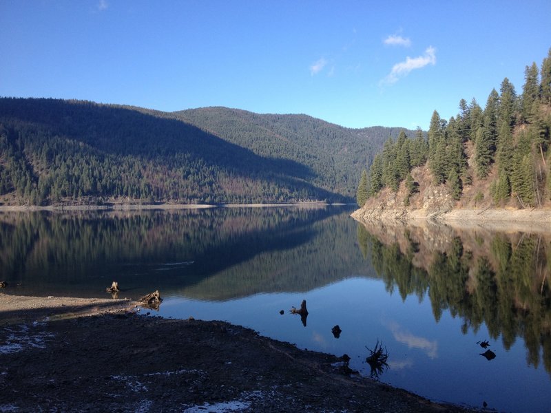 Sullivan Lake reflecting the surrounding mountains.