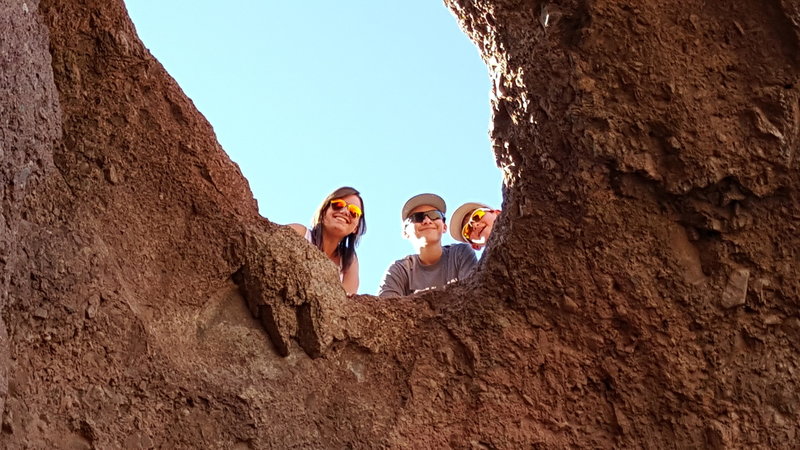 Peeking through a hole at the top of Hole in the Rock. Must boulder/scramble to actually get to the top of this rock. Not for the inexperienced.