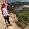 Enjoying the stunning view from one of the narrower ledges of the Beehive Trail.