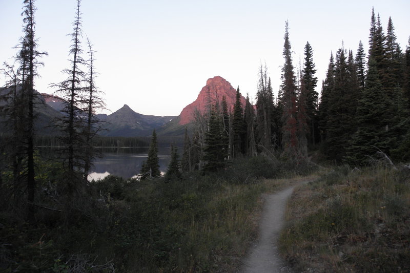 Starting the Loop Hike (going clockwise) before sunrise. Sinopah Mountain yielded an incredible alpenglow in the first mile on the trail along Two Medicine Lake.