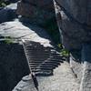 Metal grating that makes up part of the trail that you climb.