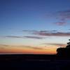 Incredible sunrise on Lake Michigan. The Michigan City lighthouse is in the distance. Taken just east of the Lakeview parking lot.